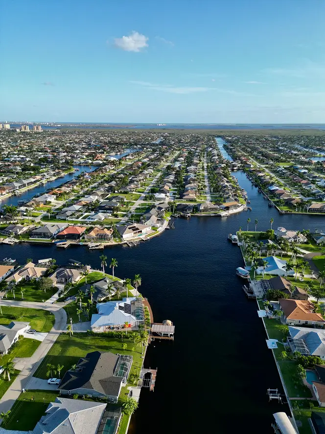 Canal lot site preparation Cape Coral FL — Universal Trax land clearing and grading
