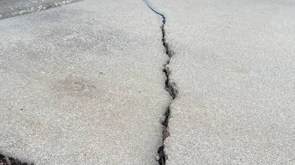 sidewalk needs ADA-compliant repair
